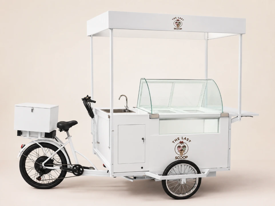 White retro mobile ice cream tricycle with a permanent glass display cooler